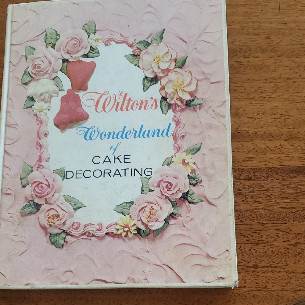 Wilton Cake Decorating Guide with Pink Floral Design